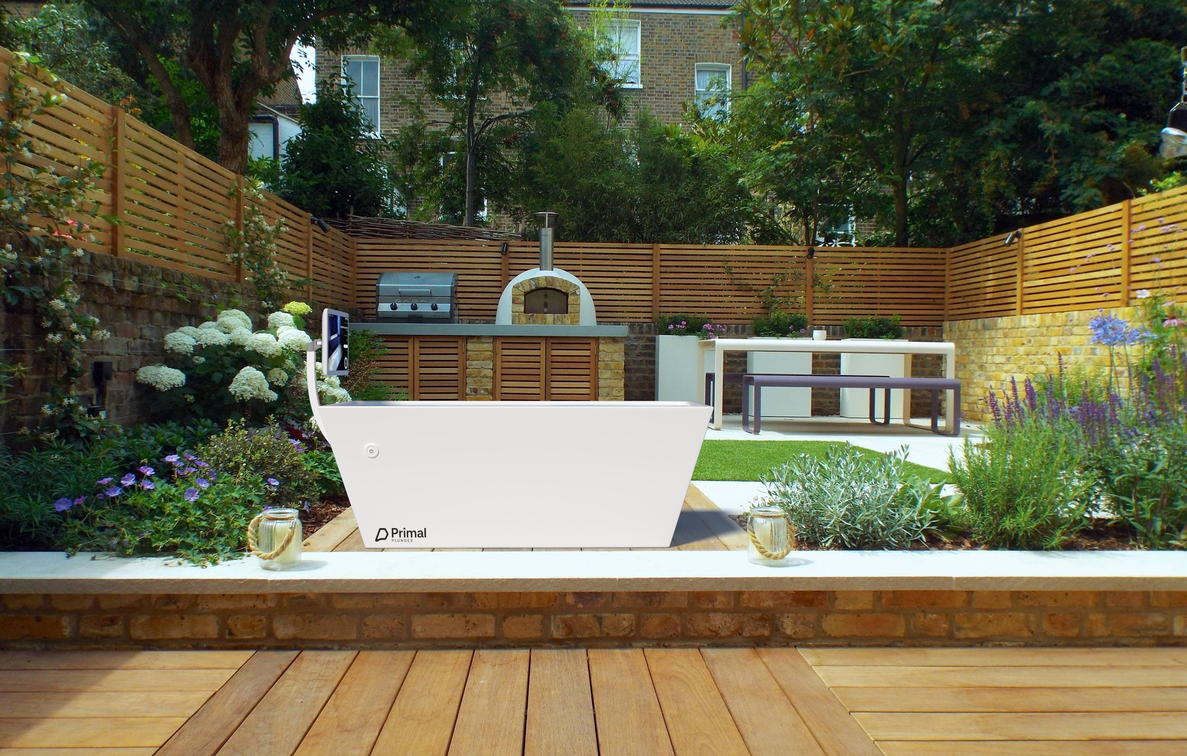 Blizzard cold plunge from Primal Plunges shown in a nice backyard with wood decking