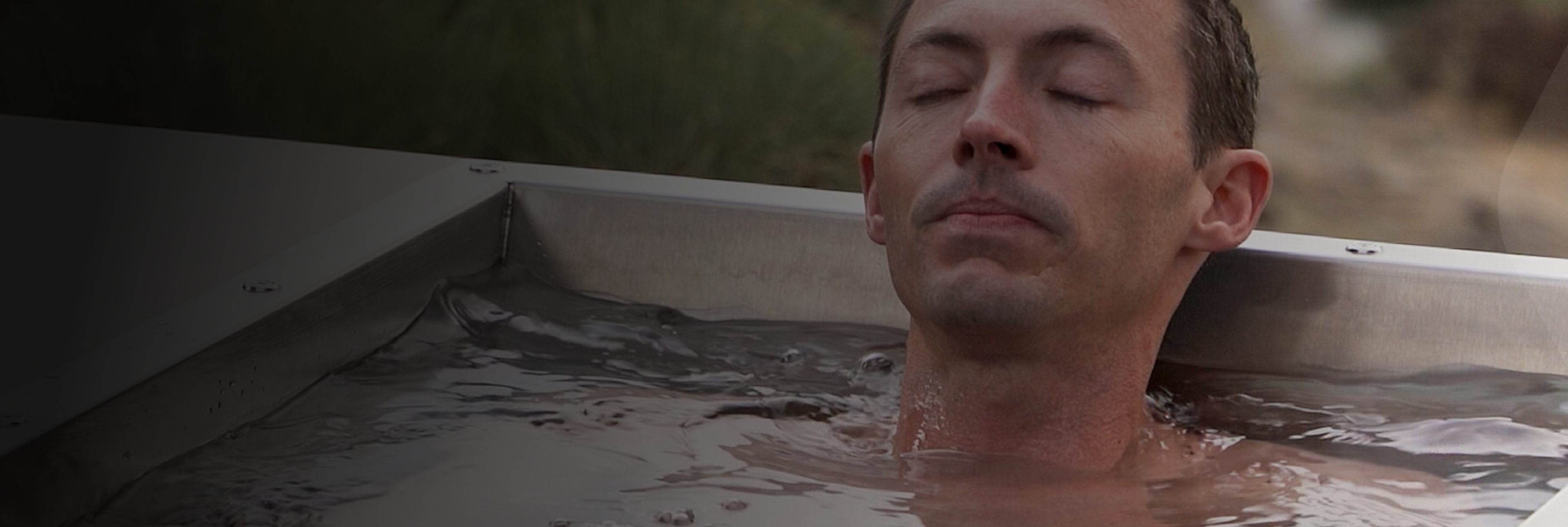 A man relaxing in a cold plunge