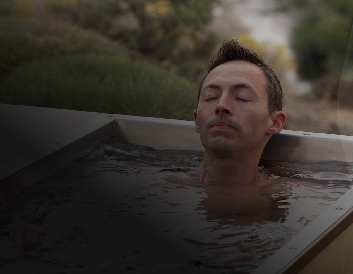 A man relaxing in a cold plunge